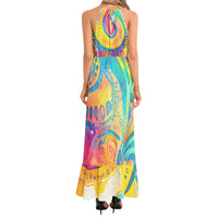 Colorful psychedelic paisley maxi dress with turquoise yellow pink and orange print halter neckline and ruffle hem