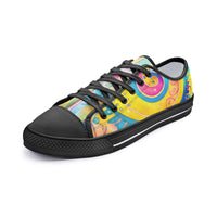 Low-top canvas shoes featuring a bold psychedelic abstract print in vibrant shades of blue, pink, purple, orange, and yellow. Modern designer sneakers with colorful swirling artwork, white laces, white rubber soles, and a contemporary streetwear aesthetic