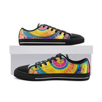 Low-top canvas shoes featuring a bold psychedelic abstract print in vibrant shades of blue, pink, purple, orange, and yellow. Modern designer sneakers with colorful swirling artwork, white laces, white rubber soles, and a contemporary streetwear aesthetic