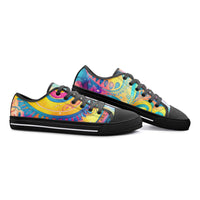 Low-top canvas shoes featuring a bold psychedelic abstract print in vibrant shades of blue, pink, purple, orange, and yellow. Modern designer sneakers with colorful swirling artwork, white laces, white rubber soles, and a contemporary streetwear aesthetic