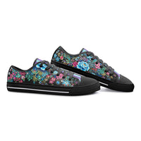 Colorful floral canvas sneakers with turquoise, pink, and blue botanical print and pastel striped tongue for men and women