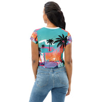 Crop top tee with neon tropical palm tree print and graffiti-style abstract color splashes in blue, pink, and orange