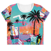 Crop top tee with neon tropical palm tree print and graffiti-style abstract color splashes in blue, pink, and orange