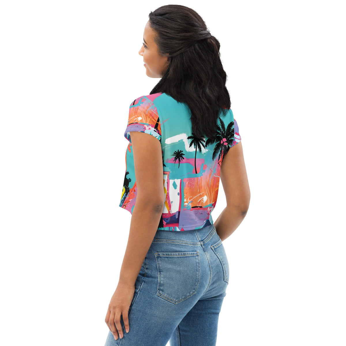 Crop top tee with neon tropical palm tree print and graffiti-style abstract color splashes in blue, pink, and orange