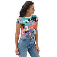 Crop top tee with neon tropical palm tree print and graffiti-style abstract color splashes in blue, pink, and orange
