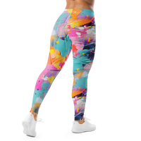 Women's colorful graphic leggings featuring an expressive paint splatter pattern in bright multicolor tones