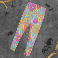 Women's psychedelic floral leggings with colorful retro blooms and swirling botanical print