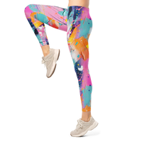 Women's colorful graphic leggings featuring an expressive paint splatter pattern in bright multicolor tones