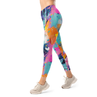 Women's colorful graphic leggings featuring an expressive paint splatter pattern in bright multicolor tones