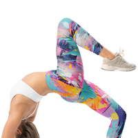 Women's colorful graphic leggings featuring an expressive paint splatter pattern in bright multicolor tones