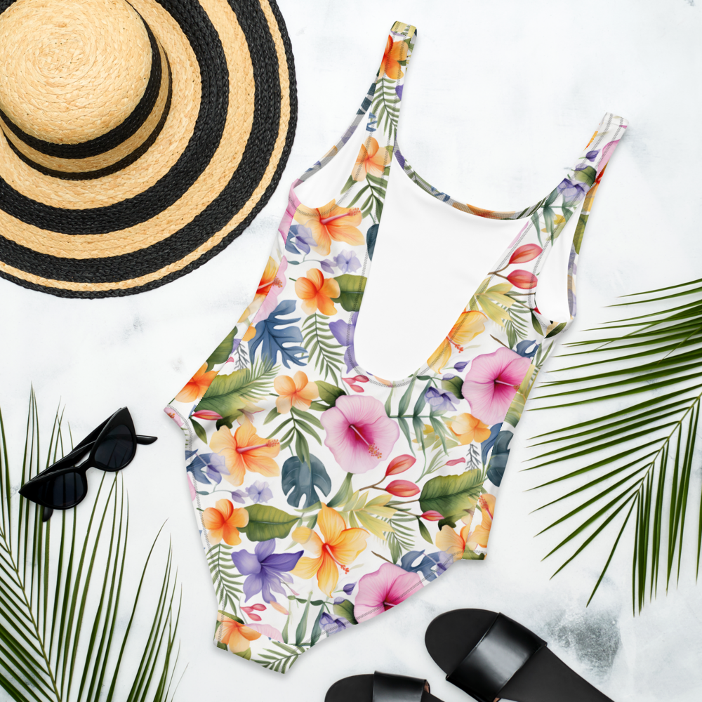 Tropical floral one-piece swimsuit with vibrant colors, flattering fit, and elegant design, perfect for beach and summer vacations.