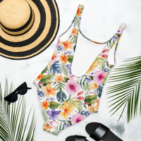 Women's tropical botanical swimsuit featuring hibiscus flowers, colorful blooms, and elegant watercolor artwork