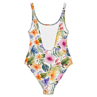 Women's tropical botanical swimsuit featuring hibiscus flowers, colorful blooms, and elegant watercolor artwork