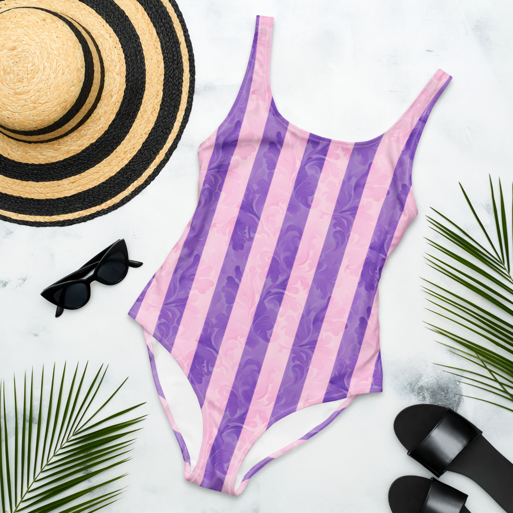 Elegant one-piece swimsuit with vertical purple and lavender stripes, textured details, flattering fit, perfect for stylish summer days.