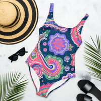 One-piece swimsuit with an intricate boho paisley mandala print in navy blue, pink, purple, green, coral, and white