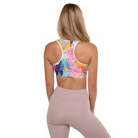 Women's multicolor paint splatter athletic sports bra with expressive abstract artwork and comfortable stretch fit
