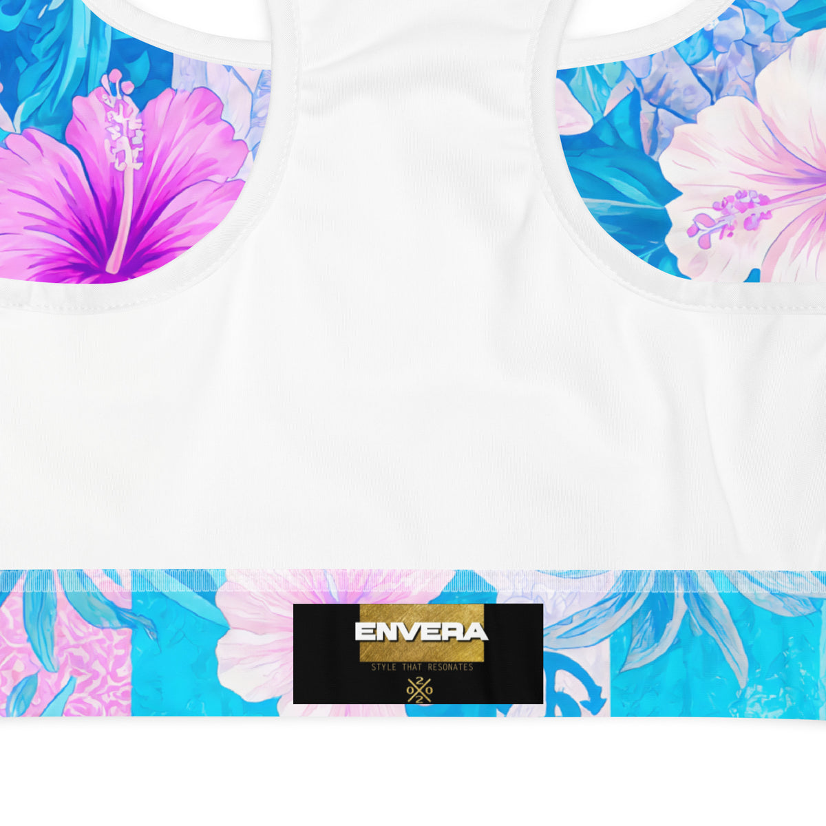 Tropical hibiscus sports bra in vibrant blue with pink floral botanical print, featuring padded moisture-wicking fabric for stylish activewear and workout