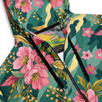 VIBRANT REBEL floral camouflage unisex zip hoodie with pink blossoms, deep green botanical camo pattern, and elegant gold accents