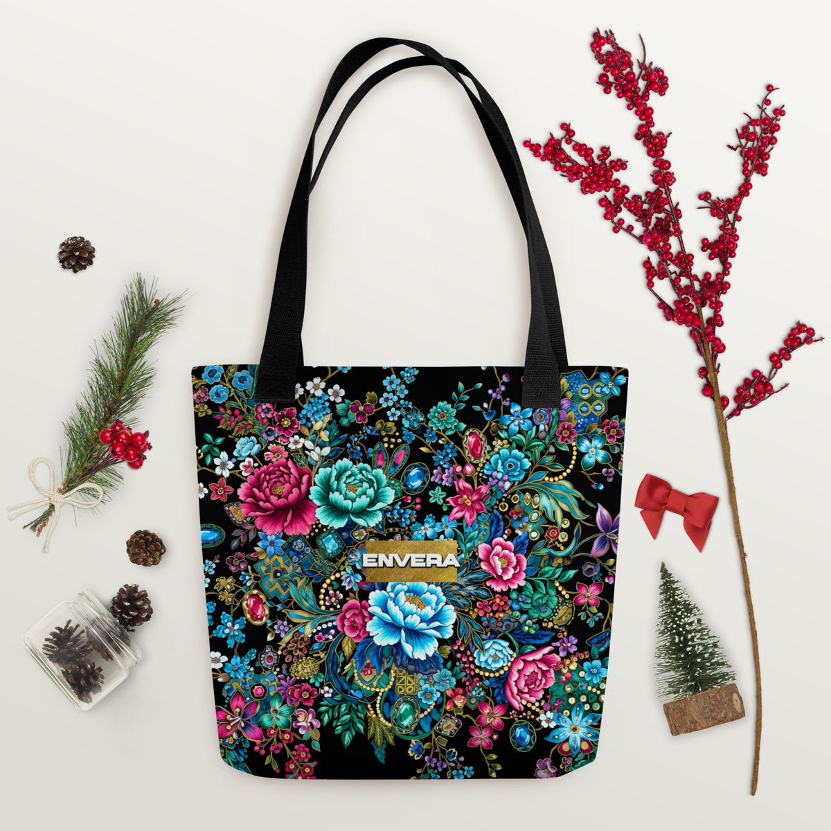 Tote bag with intricate multicolor floral pattern and jewel-inspired accents on a black background.
