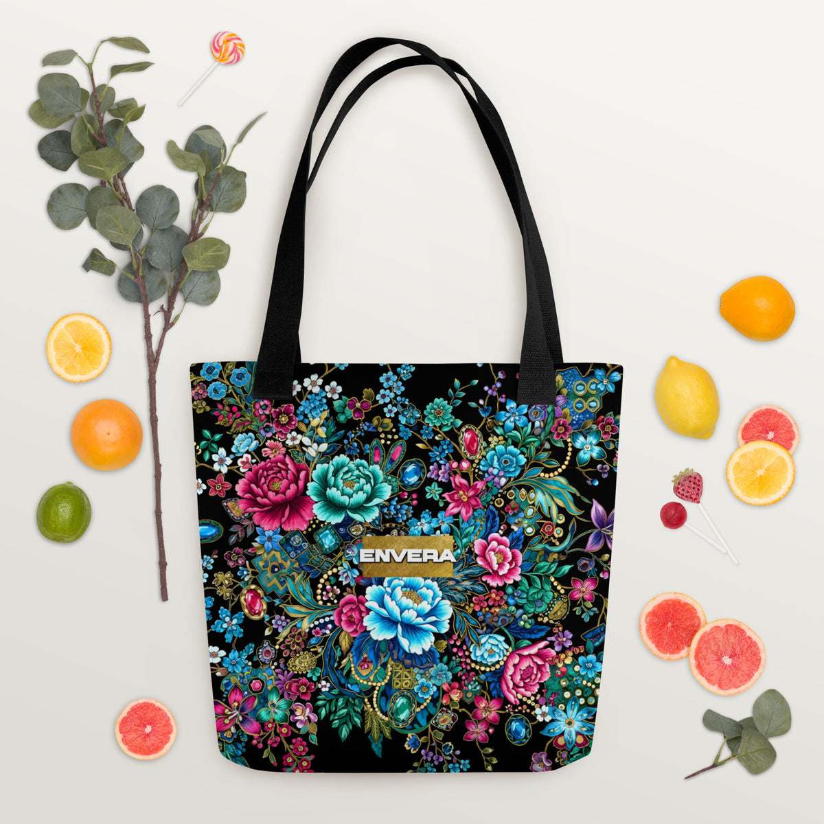 Tote bag with intricate multicolor floral pattern and jewel-inspired accents on a black background.