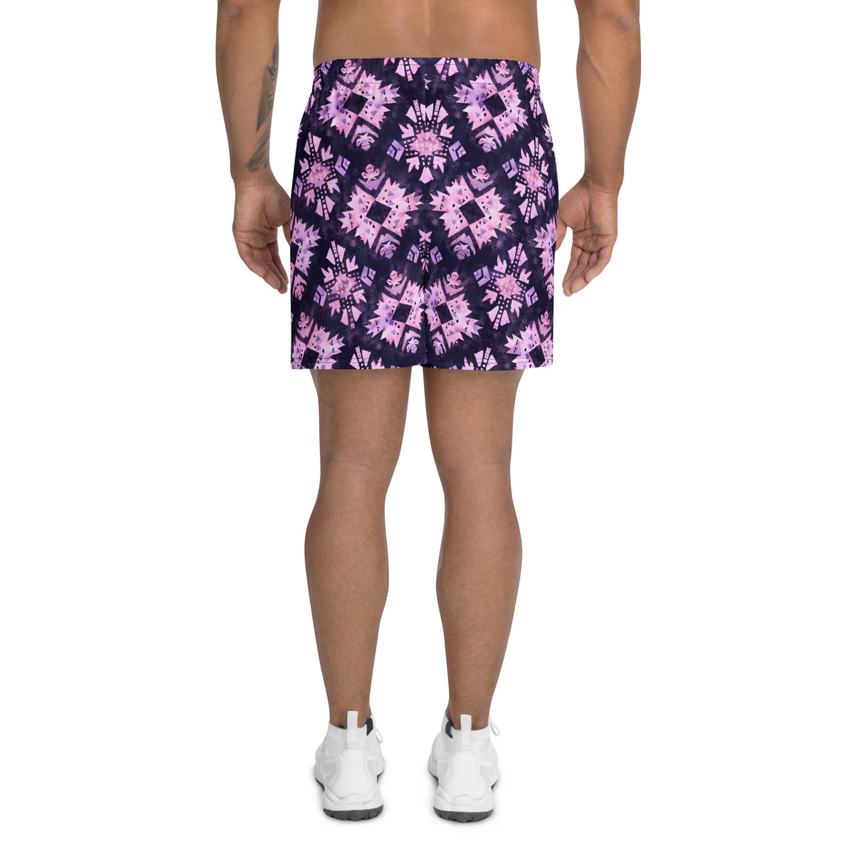 Deep purple athletic shorts with pastel pink geometric motifs and an all-over abstract tribal pattern