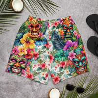 Tropical Tiki performance shorts featuring vibrant tiki mask artwork with hibiscus flowers and jungle leaves in bold tropical streetwear design