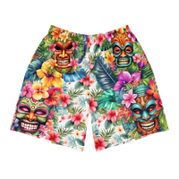Tropical Tiki performance shorts featuring vibrant tiki mask artwork with hibiscus flowers and jungle leaves in bold tropical streetwear design
