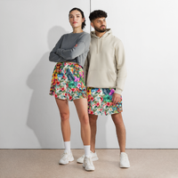 Tropical Tiki performance shorts featuring vibrant tiki mask artwork with hibiscus flowers and jungle leaves in bold tropical streetwear design