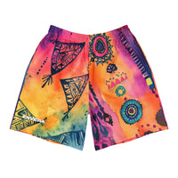 Aztec-inspired long sports shorts featuring a colorful tribal geometric abstract print with triangles, sun-like symbols, dots, decorative linework, and organic motifs in yellow, orange, coral, pink, magenta, purple, turquoise, teal, and navy. Long athletic cut with elastic waistband and white drawstring