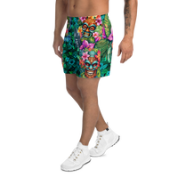 Tropical Tiki performance shorts featuring vibrant tiki mask artwork with hibiscus flowers and jungle leaves in bold tropical streetwear design