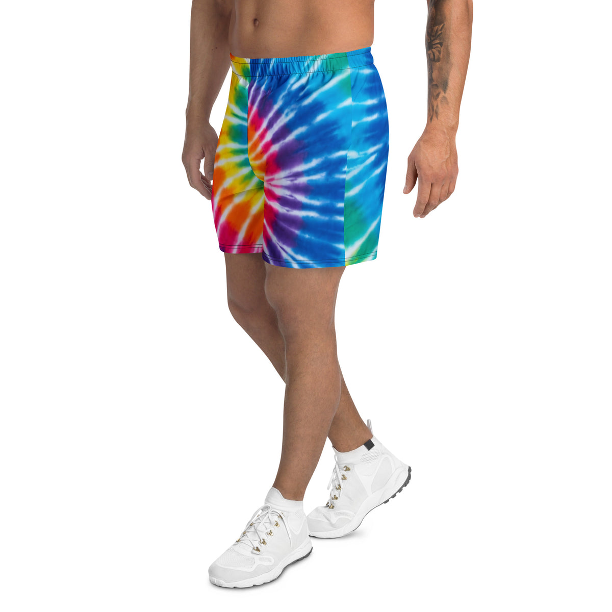 Long sports shorts with rainbow tie-dye spiral pattern in pink, orange, yellow, green, blue, and purple