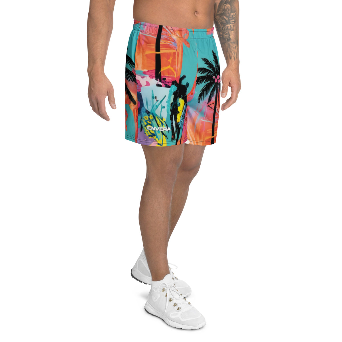 Long sports shorts with neon tropical palm print and graffiti-style abstract design in blue, pink, and orange tones