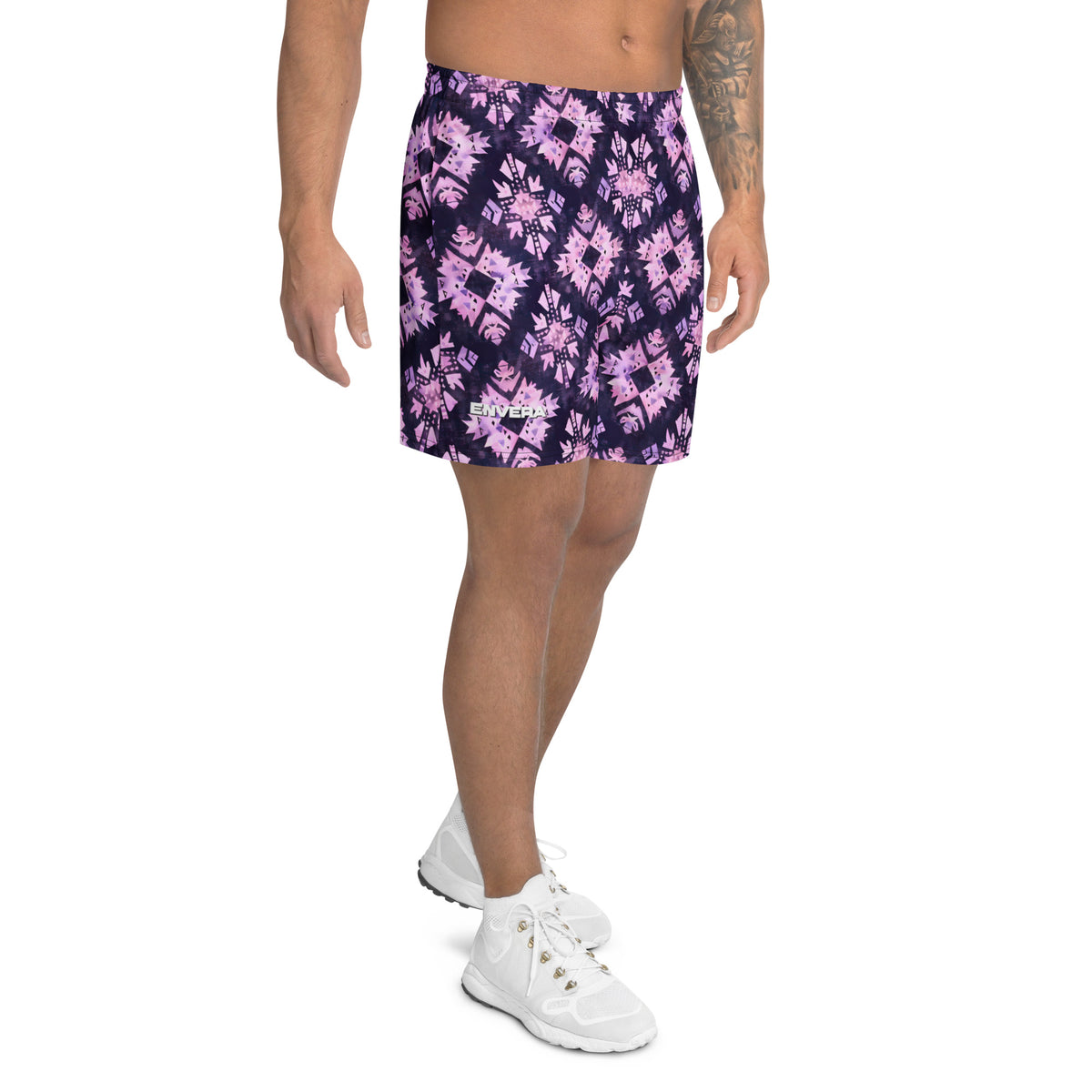Deep purple athletic shorts with pastel pink geometric motifs and an all-over abstract tribal pattern