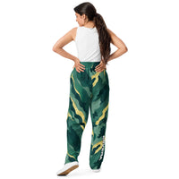 Unisex wide-leg joggers with abstract camouflage print in deep green and gold tones