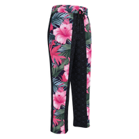 Unisex wide-leg joggers with pink hibiscus floral print and tropical palm leaves