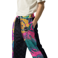Unisex wide-leg joggers with abstract color block print in turquoise, magenta, deep pink, and gold accents