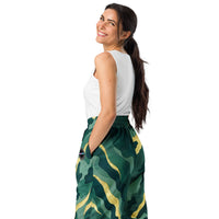 Unisex wide-leg joggers with abstract camouflage print in deep green and gold tones