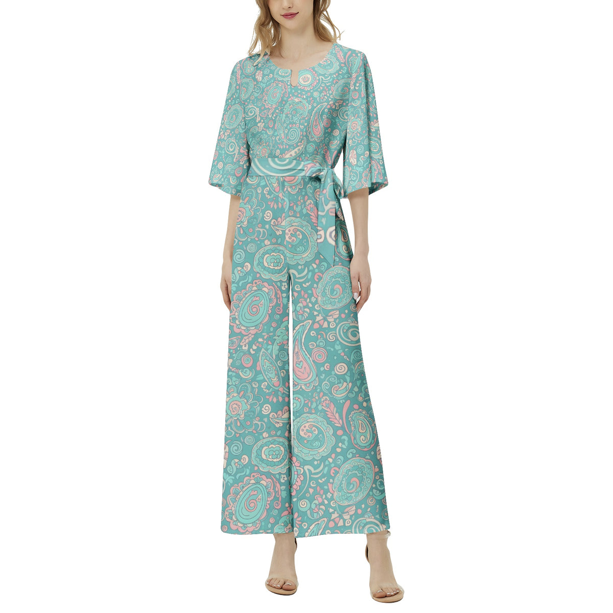 Women's pastel paisley jumpsuit with turquoise botanical print, notch neckline, and flowing wide leg silhouette