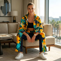 Unisex wide-leg joggers and hoodie with yellow hibiscus floral print and tropical palm leaves