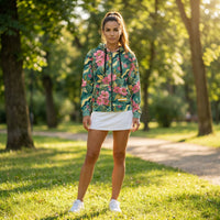 Nature-inspired floral camouflage zip hoodie with blooming pink flowers, lush green leaves, and artistic botanical print