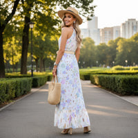 Women's pastel floral halter neck maxi dress with lavender, sky blue, blush pink, and mint botanical print
