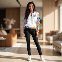 Unisex bomber jacket with colorful paint splatter design and abstract wing motif in turquoise, coral, yellow, and pink
